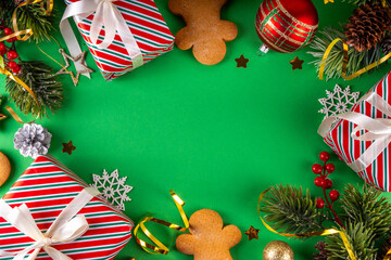 Christmas background with gingerbread man cookies, gifts and baubles