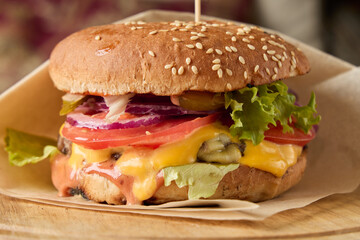 Sizzling cheese melting over savory beef, Closeup of gooey cheese cascading onto delicious burger patty