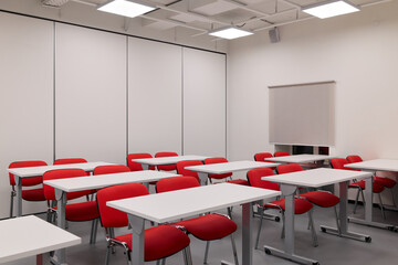 Minimalist teaching space equipped with adaptable furniture suitable for various instructional purposes