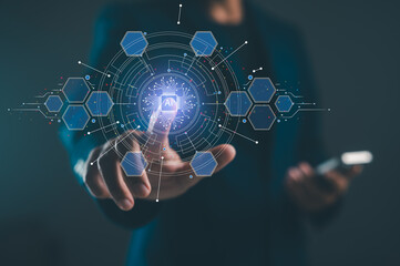 A person interacts with a digital interface showcasing artificial intelligence technology, represented by interconnected graphics and glowing elements.