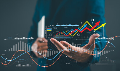 A professional analyzing data trends with hands raised, showcasing vibrant graphs and charts indicating growth and analytics.