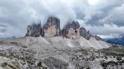 Tre Cime di Lavaredo in the Dolomites, Italy – Aerial Panoramic Mountain Landscape with Cloudy Weather, Late August