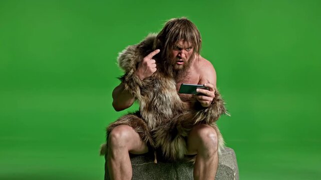 Caveman Shocked by Smartphone Technology on Green Screen