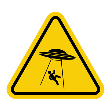 UFO. Aliens. Warning road sign. Yellow triangle with a black alien head inside. Caution, UFO activity zone. Alien abduction symbol.