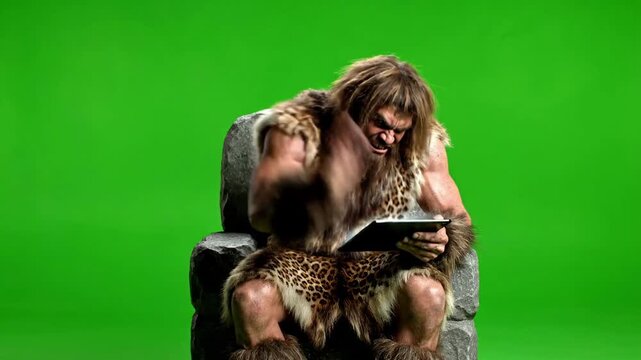 Caveman Sitting on Rock Using Tablet Interacting With Technology Green Screen