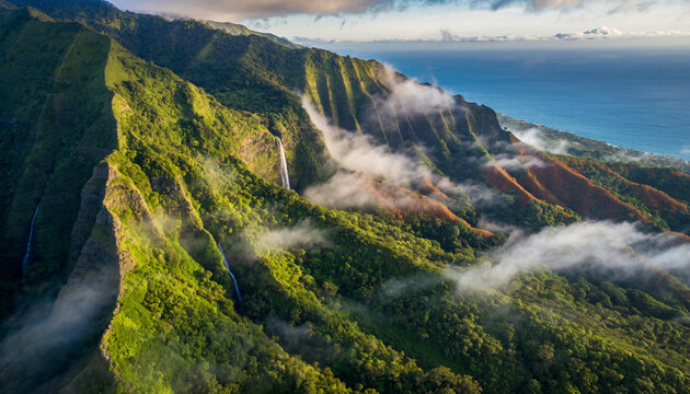Breathtaking aerial view of vibrant green tropical cliffs cascading into the deep blue ocean, adorned with misty clouds and sparkling waterfalls, creating a majestic and serene island paradise