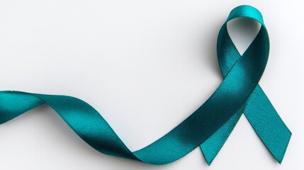 Teal awareness ribbon isolated on white background. Symbol of ovarian cancer, assault prevention and ptsd support. Background with copy space.