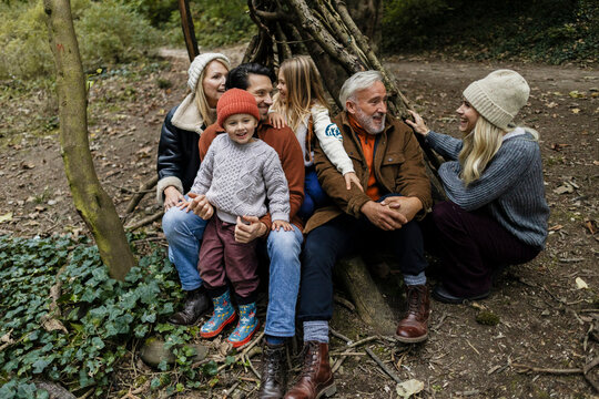 Family enjoying time together outdoors in autumn forest
