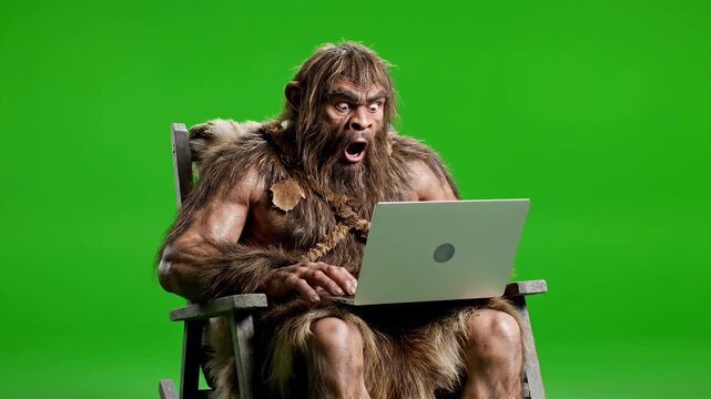 Caveman Shocked by Modern Computer Technology on Green Screen