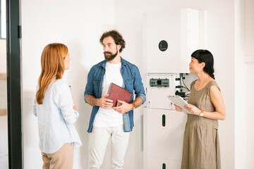 Team consulting on sustainable technology project indoors