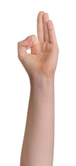 Woman showing okay gesture on white background, closeup