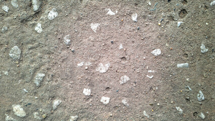 Close Up Abstract Texture Of A Rough Grey Concrete Surface With Small White Aggregate Inclusions