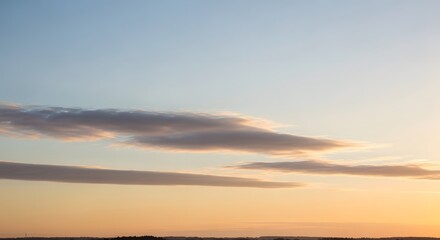 Obraz premium Layered Clouds Golden Sunset Sky Horizon Serene Atmosphere