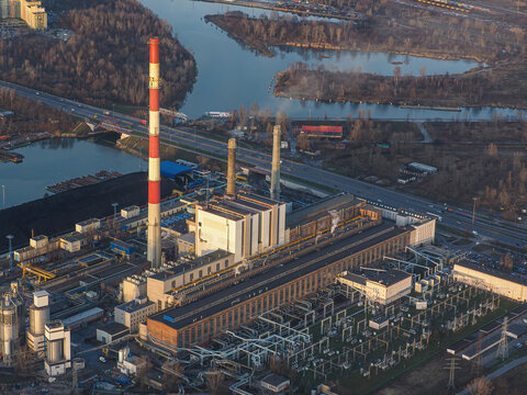 Aerial View of Industrial Power Plant with Coal Stockpile by the River
