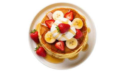 Isolated stack of pancakes with strawberries, bananas, whipped cream, maple syrup, and plate