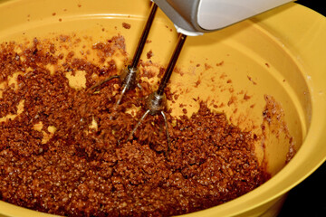 German Christmas bakery, mixing a dough for Lebkuchen