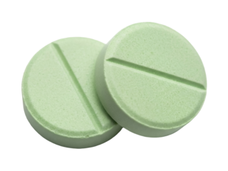 Isolated round mint green prescription medication tablets for health and wellness use