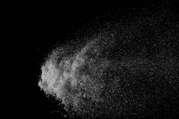 The falling white snow on a black background