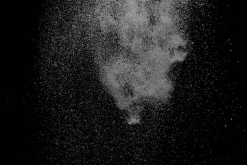 The falling white snow on a black background