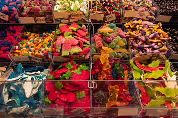 Colorful assortment of gummy candies in market display
