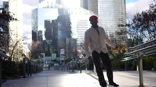 Urban dancer performing on a sunny city street