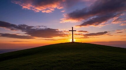 Stunning cinematic video footage of a wooden cross silhouetted against a dramatic golden sunset on a grassy hill - Powered by Adobe