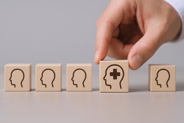 Mental Wellness Concept: Hand Placing Positive Mindset Block Among Others, Illustrating Mental Health and Wellbeing