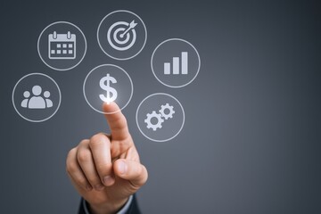 Business Strategy Concept: Man Selecting Financial Growth Icon From Digital Interface, Goal Setting and Teamwork