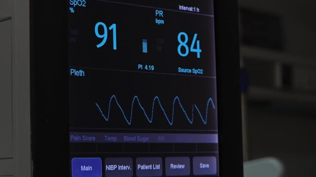 Camera Focuses on Patient Vital Signs Monitor