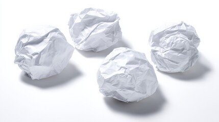 Fototapeta premium Conceptual Shot of Crumpled White Paper Balls on a White Background Symbolizing Creative Block