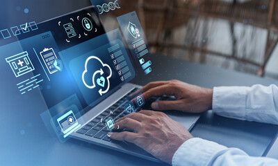 Healthcare cloud computing concept showing digital medical records and secure data access with futuristic interface on laptop background.