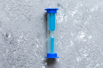 hourglass on the table, sand clock as time passing concept for business deadline, copy space