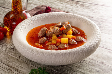 Tomato soup with meatballs and vegetables