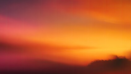 Fototapeta premium An ethereal sunset sky transitions from deep red to fiery orange and golden hues
