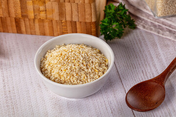 Raw dry sesame seeds heap