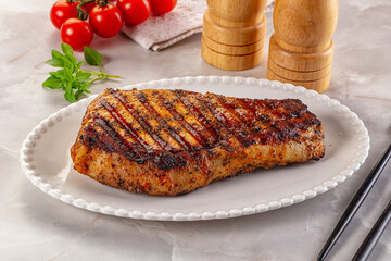 Grilled pork steak with bone