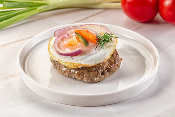 Beefsteak chop with roasted egg