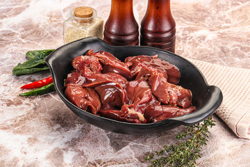 Raw uncokked chicken liver in the bowl