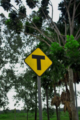 T junction warning road sign stock photo