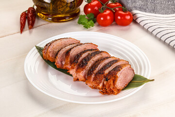 Sliced duck breast baked with cherry
