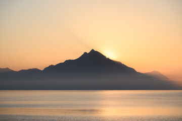 Sunrise over Mount Athos viewed from Sarti, Greece