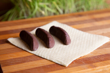 Three Chocolate Crescent Cookies On Napkin On Wooden Table Still-Life