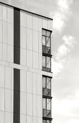 Cloud Dancer, trendy off-white color of the Year 2026. A close view of a modern building facade.