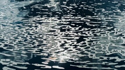 abstract pattern with waves of green water and white foam