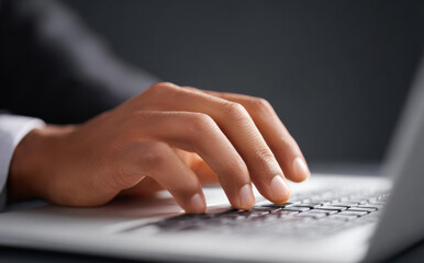 Close up hand of business man typing on laptop computer keyboard with serious focus and hardworking emotion in office workplace using technology for internet online communication connection
