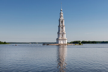 The flooded bell tower of St. Nicholas Cathedral rises above the surface of the Volga River. Kalyazin, Tver region.