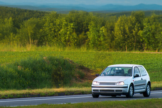 Elegant turbocharged youngtimer traveling on open road