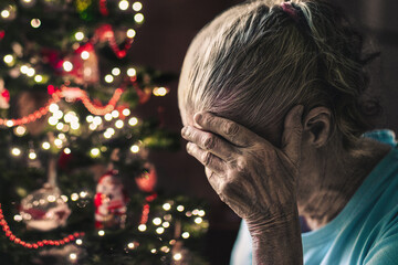 Sad on christmas. Old woman, lonely senior on winter holiday. Depressed elderly on xmas season....