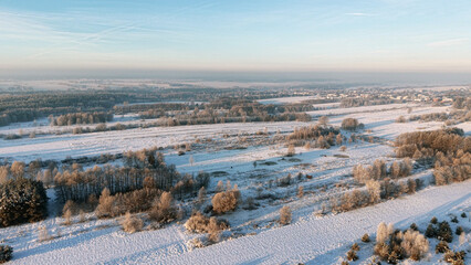 Hoarfrost covers the trees in winter countryside