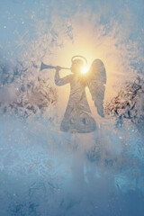 Christmas Angel Silhouette Shining Through Frosted Window At Sunrise. Concept Of Spiritual Holiday Symbolism, Peaceful Winter Mood, And Religious Imagery For Seasonal Greetings And Devotional Designs